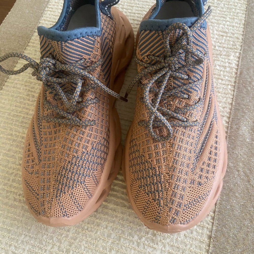 Blue and Tan Athletic Shoes with Comfortable Padding and Textured Fabric